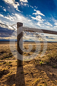 Barbed Wire Fence at Sunset