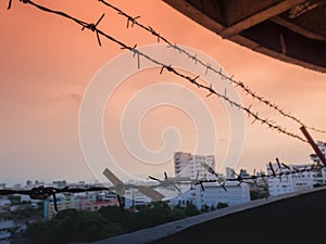 Barbed wire fence with Twilight sky to feel Silent and lonely and want freedom