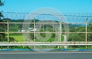 Barbed wire fenced border of the DMZ seperating North and South Korea at Dorasan Station, Republic of Korea