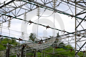 barbed wire on the impassable border in dark dramatic tones of the protected area without people photo