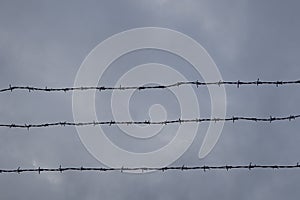 Barbed Wire Prison Zone Secret Territory and Rainy Clouds