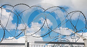 Barbed wire Razor Blades Type Military on blue sky