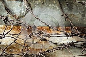 Barbed wire rusty metal wall background