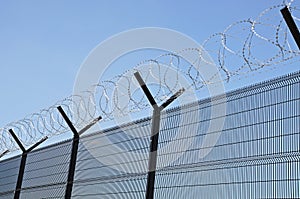 Barbed wire security fence.