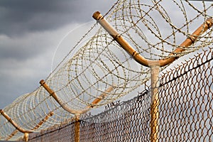 Barbed wire security perimeter fence