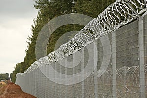 Barbed wire steel wall against the immigrations in Europe