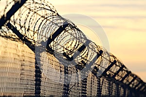 Barbed wire steel wall against the immigrations in europe photo
