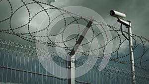 Barbed wire and surveillance camera