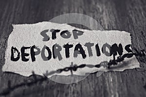 Barbed wire and text stop deportations