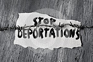 Barbed wire and text stop deportations