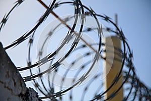 Barbed Wire on top of a old Wall