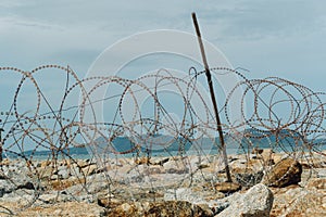 Barbed Wire on Trespass Island with Blue sky photo
