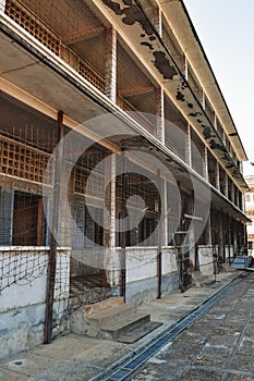 Barbed-wired prison building in S21 Tuol Sleng Genocide Museum Phnom Penh Cambodia