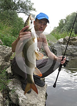 Barbel fishing on river photo