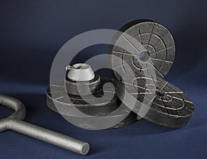 Barbell discs for fitness brutal look on a dark background