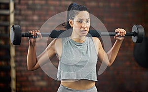 Barbell, exercise and woman in fitness gym for workout, training and challenge to be fit, strong and healthy. Girl