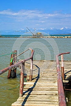 Barbell fishing shed or fishing hut at the river mouth