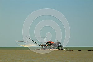 Barbell fishing shed or fishing hut at the river mouth