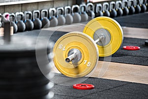 Barbell on the floor in gym photo