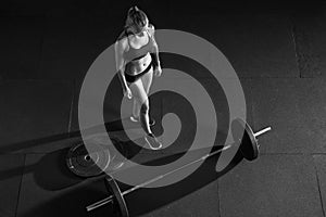 Barbell girl Barbell on gym floor