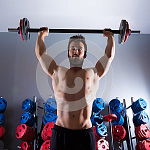 Barbell man workout fitness at weightlifting gym