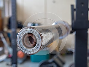 Barbell sitting on weight rack