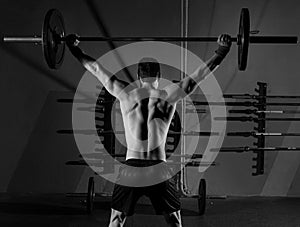 Barbell weight lifting man rear view workout gym