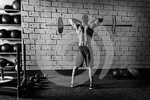 Barbell weight lifting man rear view workout gym