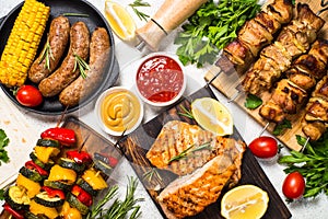 Barbeque dish - Grilled meat, fish, sausages and vegetables.