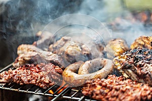 Barbeque grill mixed meat cooking on open air photo