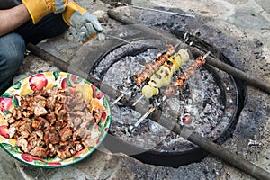 Barbeque meat kebabs.Grilled kebabs cooking on metal skewers.