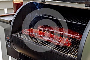 Barbeque racks of ribs with sauce