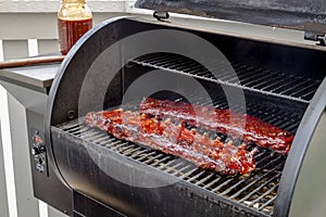 Barbeque racks of ribs with sauce