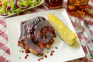 Barbeque racks of ribs with sauce