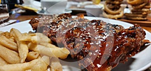 barbeque ribs fries chargrilled dinner food photo