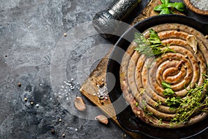 Barbeque sausages on cast iron pan