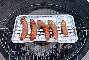 Barbeque sausages on a grill