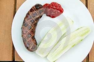 Barbequed Sausage served with fresh cucumber