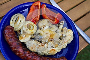 Barbequed sausages and vegetables