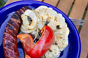 Barbequed sausages and vegetables