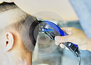 A barber is cutting Hair for Children