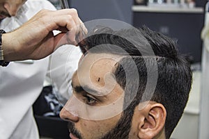 Barber cutting hair