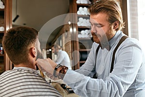 Barber Cutting Man Beard In Barber Shop. Beard Hair Cut