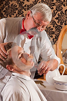 Barber cutting mustache