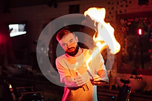 Barber demonstrates fire for haircut with scissors