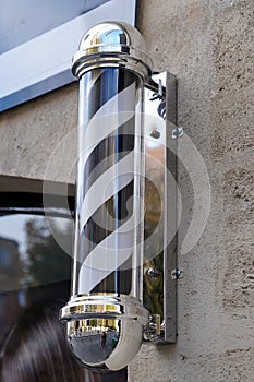 Barber round black white round pole shop sign silver in vintage hairdresser entrance