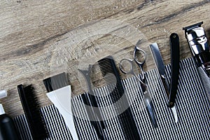 Barber`s hair cut kit, striped towel lined with scissors, hair, tidour, dangerous razor and hair brush