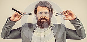 Barber scissors and straight razor, barber shop, suit. Vintage barber shop, shaving. Portrait bearded man