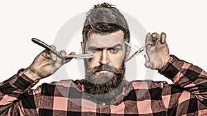 Barber scissors and straight razor, barber shop. Vintage barbershop, shaving. Bearded man, bearded male. Portrait of