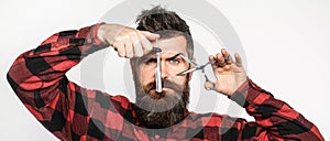 Barber scissors and straight razor, barbershop. Mens haircut, shaving. Bearded man, long beard, brutal, caucasian